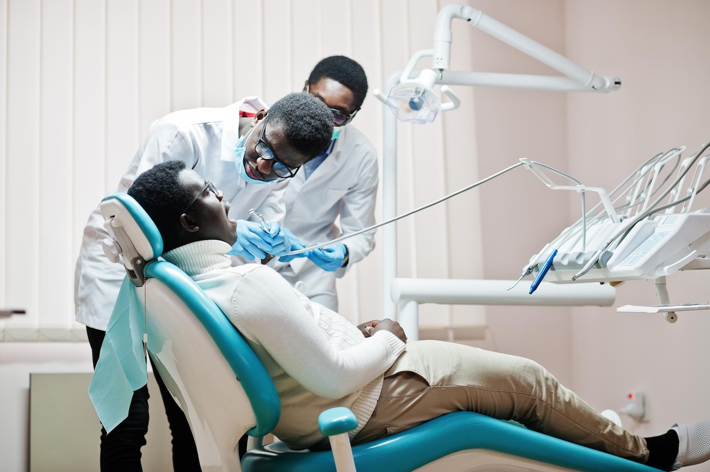 african-american-man-patient-dental-chair-dentist-office-doctor-practice-concept-professional-dentist-helping-his-patient-dentistry-medical-drilling-patient-s-teeth-clinic_627829-13721